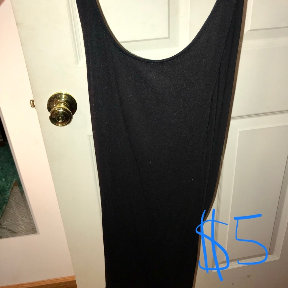 Black tank with crossover in back.